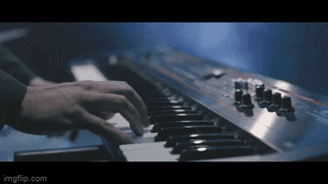 a close up of a person playing a keyboard with the url imgflip.com