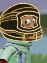 a cartoon character wearing a helmet with big eyes on it .