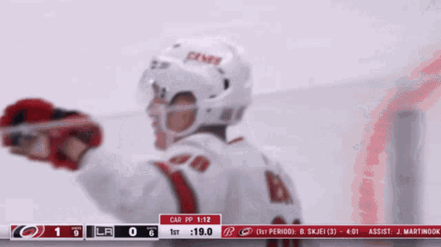 a hockey player wearing a jersey with the name necas on it