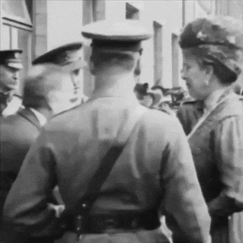a black and white photo of a group of people in uniforms