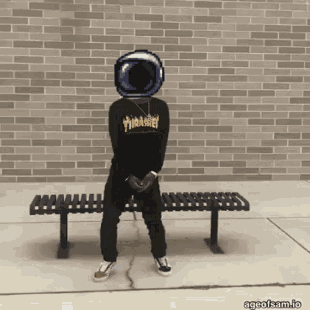 a person wearing a thrasher shirt is standing on a bench