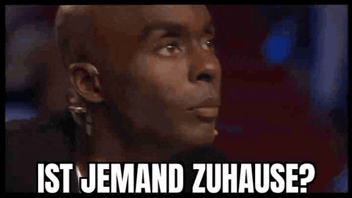 a bald man with a microphone in his ear says ist jemand zuhause ?