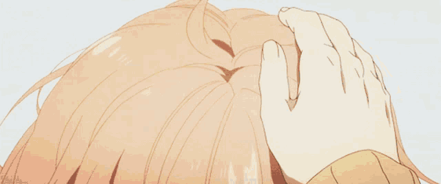 a close up of a girl 's head with a hand on it