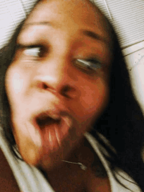 a blurry picture of a woman with her mouth open