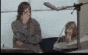 a blurry picture of two people sitting at a table