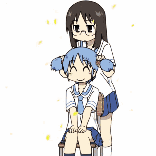 a girl is brushing another girl 's hair while another girl sits in a chair