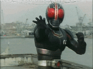 a man in a black and red superhero costume with the number n on his chest