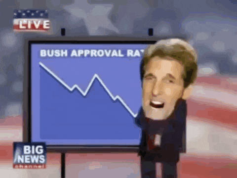 a man is standing in front of a screen that says bush approval rate on it