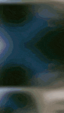 a dark blue background with a few spots of light