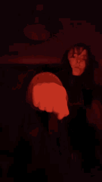 a blurry photo of a person 's face in the dark