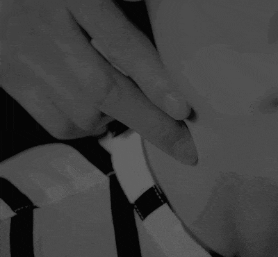 a black and white photo of a person 's neck
