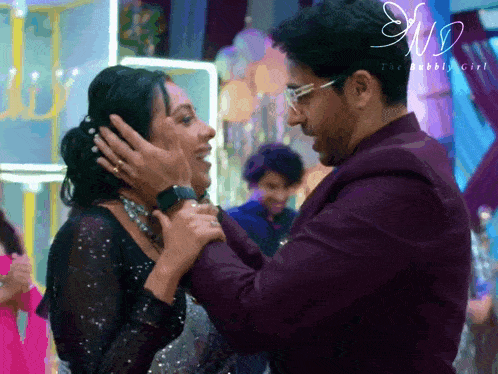 a man is touching a woman 's face with a watermark that says ' the bubbly life '