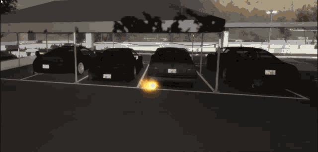 a row of cars are parked under a canopy and one of the cars has a license plate that says ' rj '