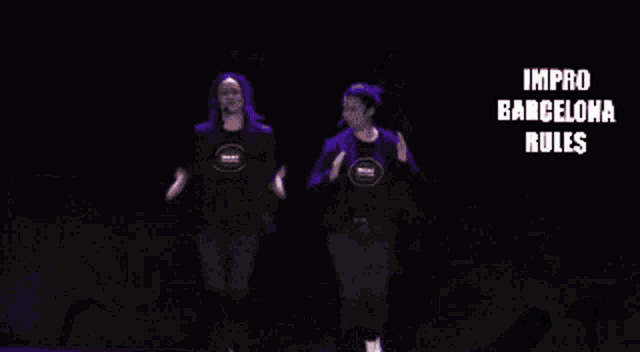 two people are dancing on a stage with the words improv barcelona rules behind them