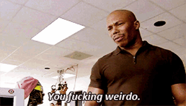 a man in a brown shirt says you fucking weird