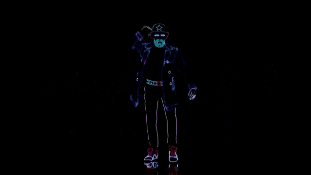 a group of glow in the dark dancers are dancing
