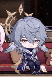 a boy with wings is sitting on a couch in a room .