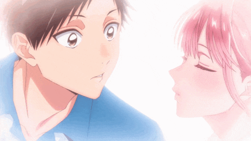 a boy and a girl are looking at each other and the girl has pink hair
