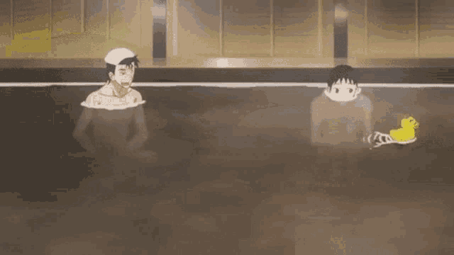 a couple of men are taking a bath in a hot tub .