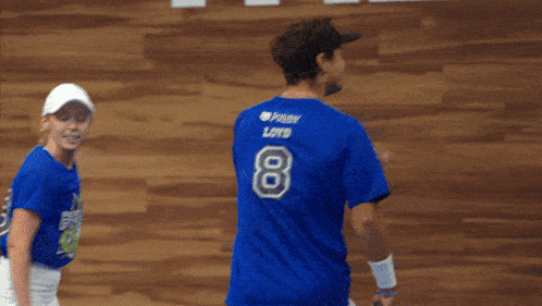 a man wearing a blue shirt with a picture of a dog on it