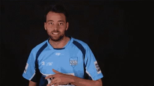 a man wearing a blue shirt that says ' rbt means you need a plan b ' on it