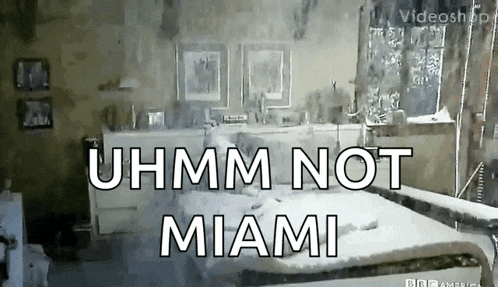 a bedroom with a bed and the words uhmm not miami on the bottom