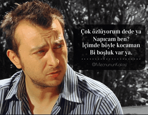 a man in a striped shirt with a foreign language quote