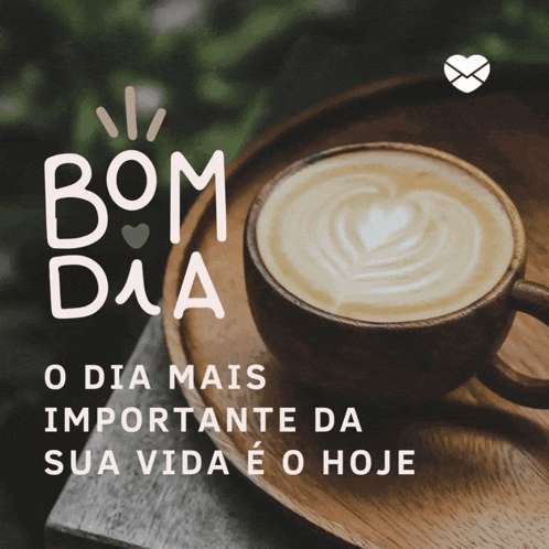 a cup of coffee sits on a wooden tray with bom dia written above it