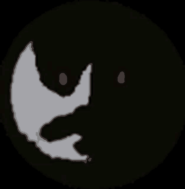 a black and white silhouette of a face with red eyes in a dark circle .