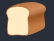 a loaf of bread with a bite taken out of it on a dark background .