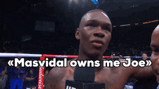 a man in a boxing ring with the words masvidal owns me joe on the bottom