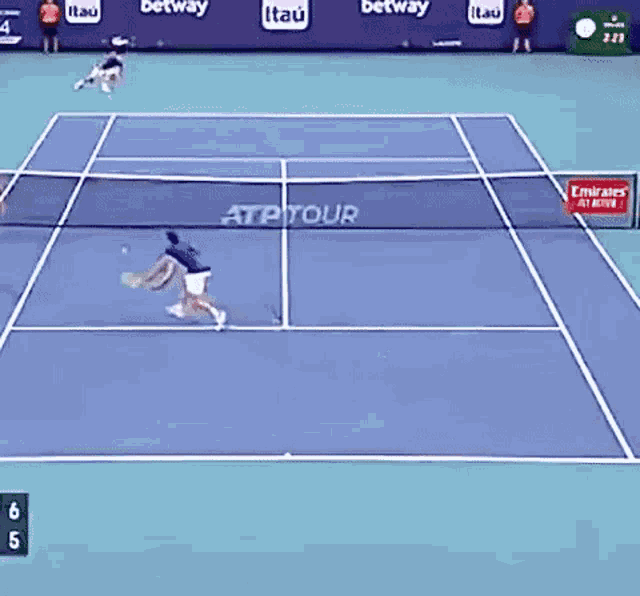 a tennis game is being played on a court that says atp tour