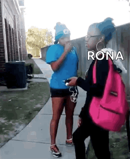 two girls are standing on a sidewalk with the word rona on the bottom