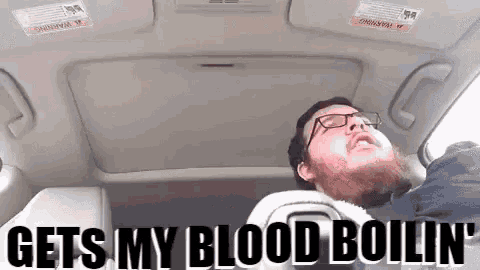 a man with glasses is sleeping in the back seat of a car with the caption gets my blood boiling