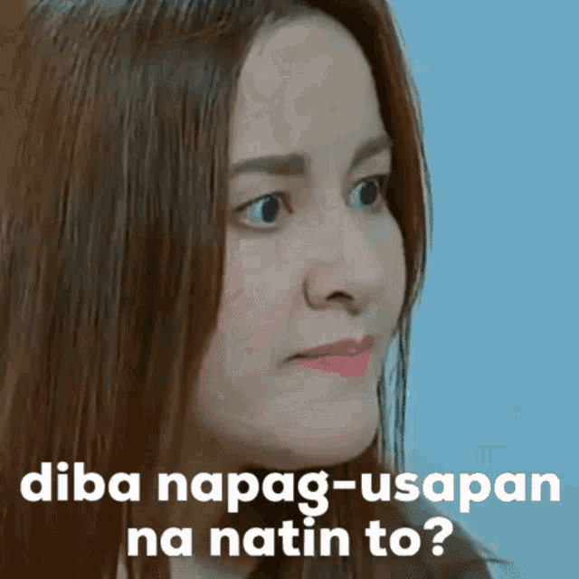 a close up of a woman 's face with the words " diba napag-usapan na natin to " written on it
