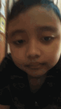 a close up of a person 's face with a black background