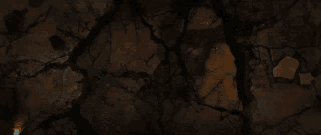 a hand is reaching out from a cracked wall