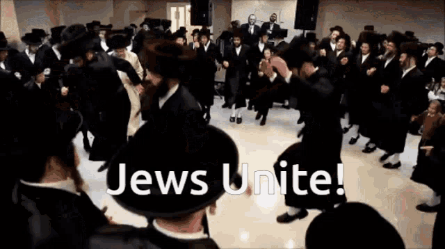 a group of jews are dancing in a room with the words jews unite above them