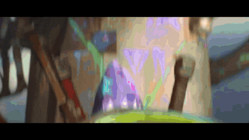 a blurry picture of a painting with a purple and green colored background