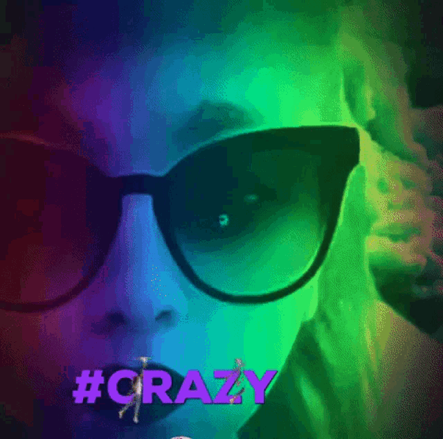 a close up of a woman wearing sunglasses with the words #crazy on the bottom
