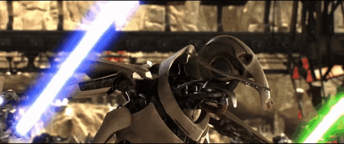 a robot is holding two lightsabers in front of a building