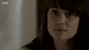 a close up of a woman 's face with bbc on the bottom right