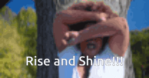 a blurred image of a person with the words rise and shine