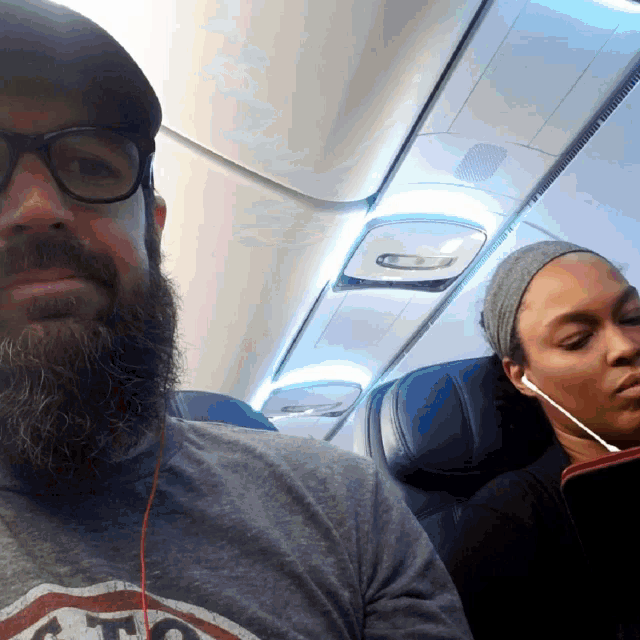a man with a beard is wearing a shirt that says chicago on it