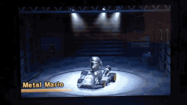 a video game shows a metal mario kart in a dark room