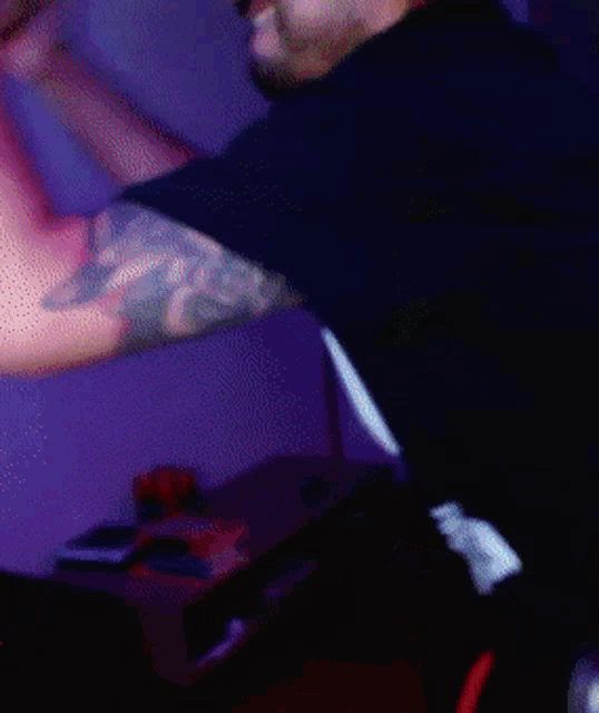 a blurry picture of a person 's arm reaching out towards the camera