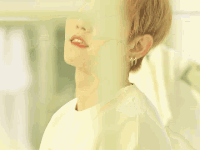 a close up of a man 's face with a yellow background