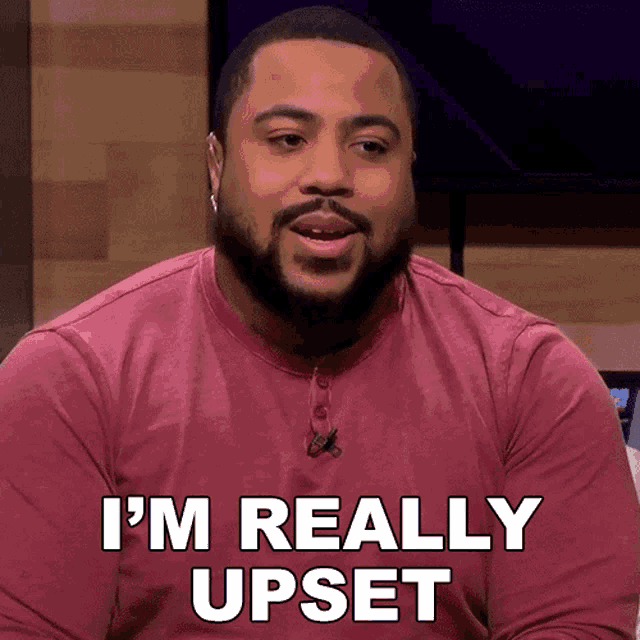 a man says i 'm really upset in a red shirt