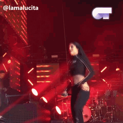a woman dancing on a stage with the name lamalucia on the bottom