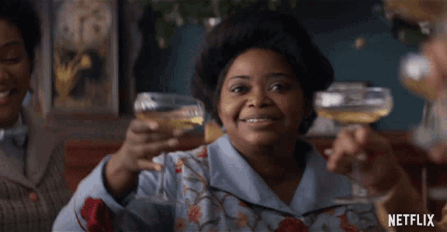 a netflix ad shows a woman toasting with champagne
